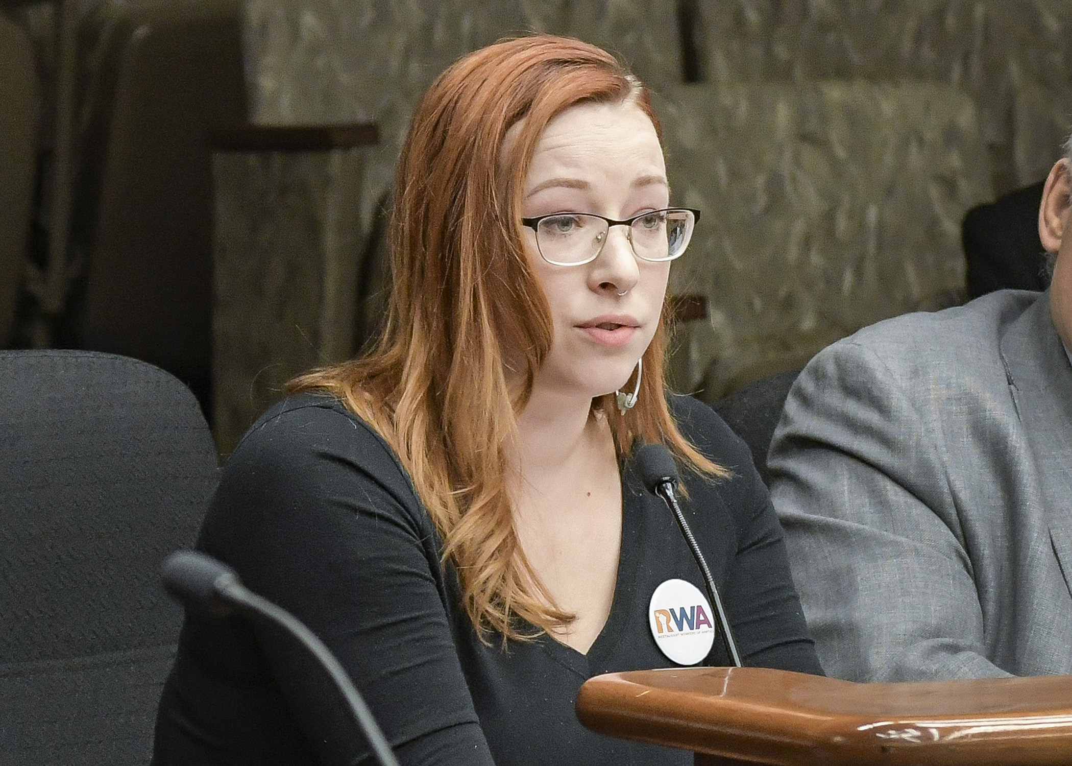 Jennifer Schellenberg, president of Restaurant Workers of America and bartender at Northbound Smokehouse Brewpub in Minneapolis, testifies April 16 before the House Job Growth and Energy Affordability Policy and Finance Committee for a bill that would modify the minimum wage for employees receiving gratuities. Photo by Andrew VonBank